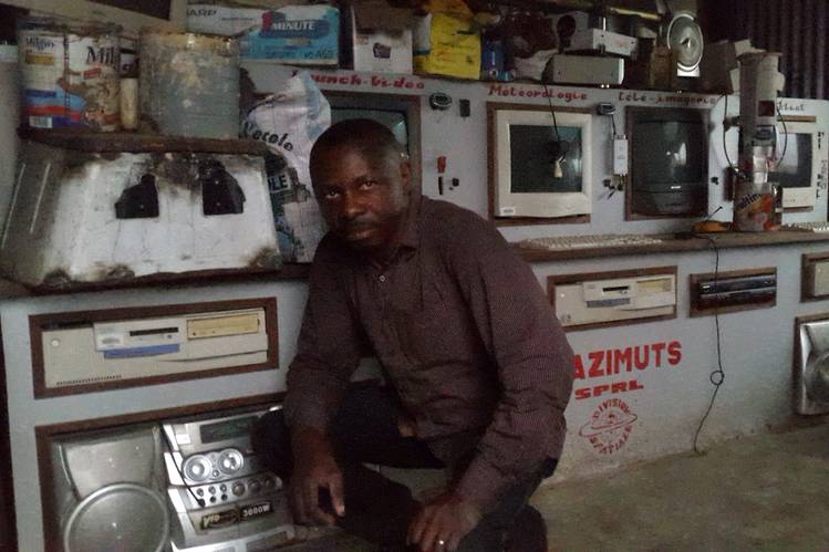 Ground control for Mr. Keka’s space program is a shed with a tin roof. Inside are old computers and televisions.